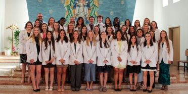 College of Saint Mary physician assistant students receive white coats during ceremony